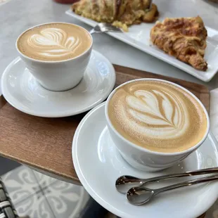 Hot vanilla latte with whole milk and hot honey latte with oat milk