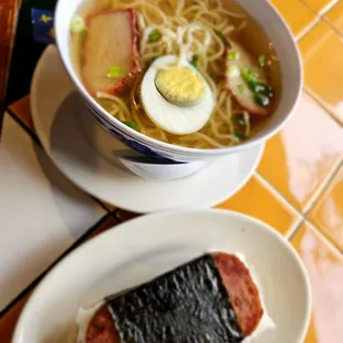 a bowl of ramen and a sandwich