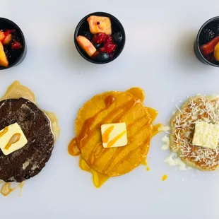 a variety of pancakes and fruit