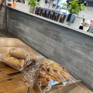 two bags of cookies on a table