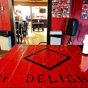 a red table with a sign on it