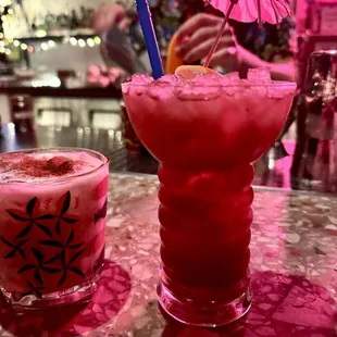 two cocktails with umbrellas
