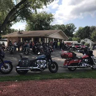 a group of motorcycles parked in front of a building