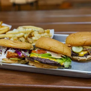a tray of hamburgers and fries