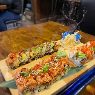 Negi Tori roll (torched), Reidvill roll behind (tempura battered), salmon lover roll (right)