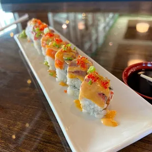 a long rectangular plate of sushi