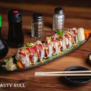 a sushi roll on a plate with chopsticks