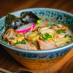 a bowl of ramen on a table