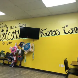 a yellow wall with a welcome sign