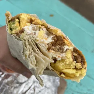 Queen's burrito added avocado and sour cream.