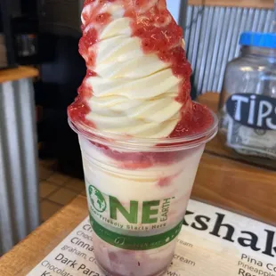 Dole whip with strawberry puree drizzle