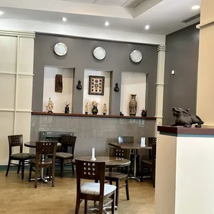 an empty restaurant with tables and chairs