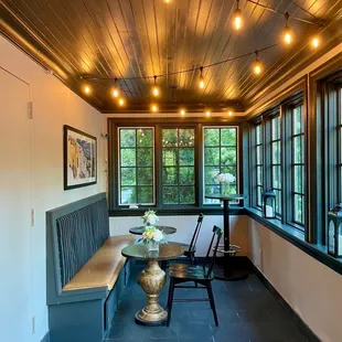 a dining room with a table and benches