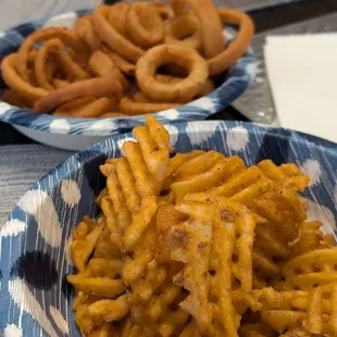 Seasoned waffle fries and onion rings
