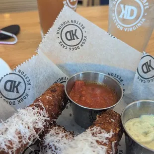 Mozzarella cheese sticks with marinara sauce and pesto lime sauce