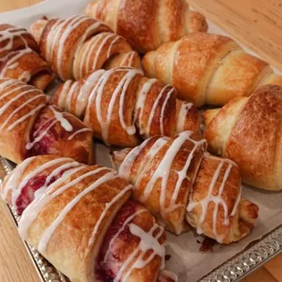 a tray of croissants on a table