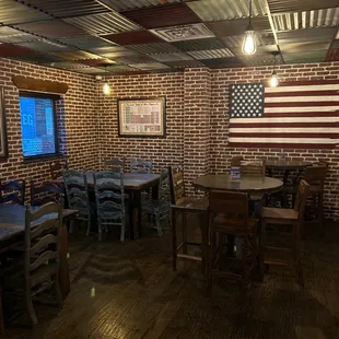 a brick wall with american flag on it