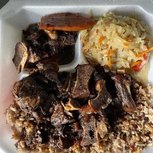 Oxtail with rice, beans and cabbage