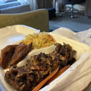 Ox tails,cabbage and fried plantains.