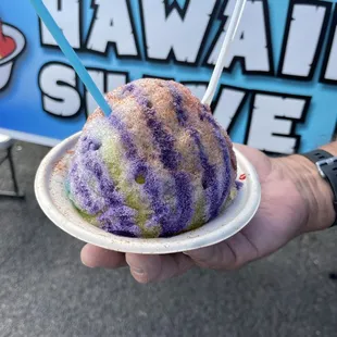 a hand holding a dessert