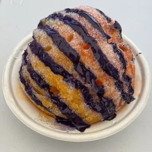 a blueberry donut on a plate
