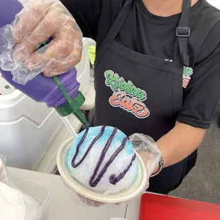 a woman in a black shirt and a black apron