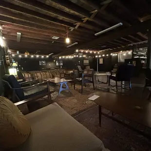 a living room with a couch and chairs