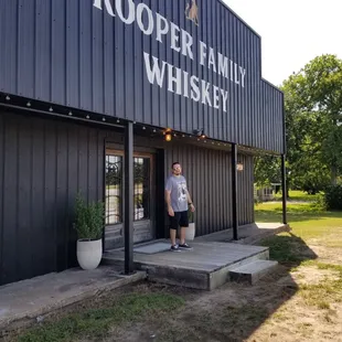 a man standing in front of a building