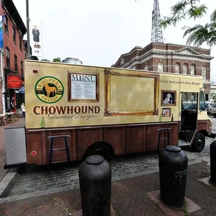 the food truck parked on the side of the street