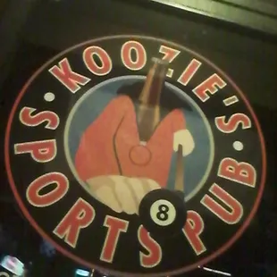 a pool ball in the middle of the sign