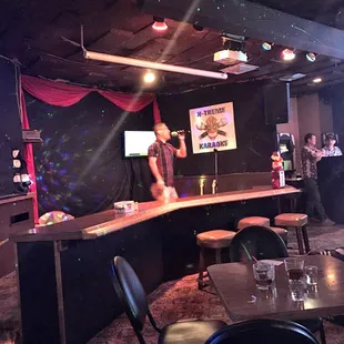 a man standing at a bar