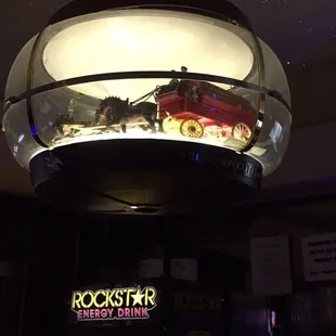 a model of a firetruck in a glass dome