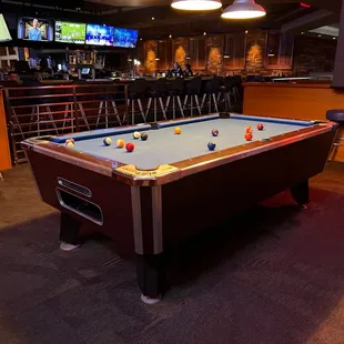 a pool table in a bar