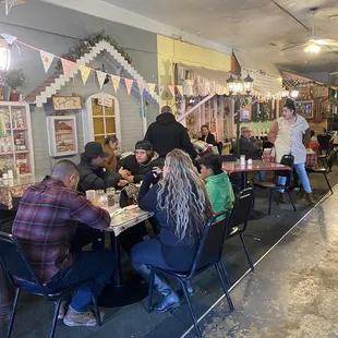 The dining room with a country theme. They are busy but they try to serve people quickly.