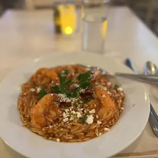 a plate of pasta with shrimp