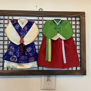 a picture of a pair of kimonos hanging on a wall