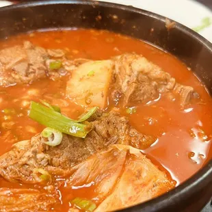 a bowl of stew with meat and vegetables