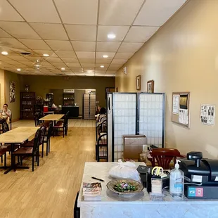 a dining room with tables and chairs