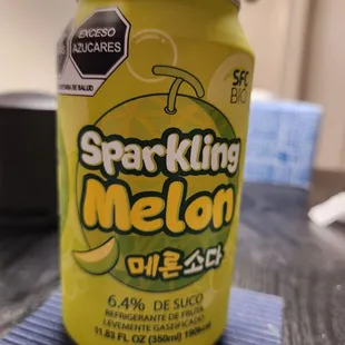 a can of soda sitting on a table