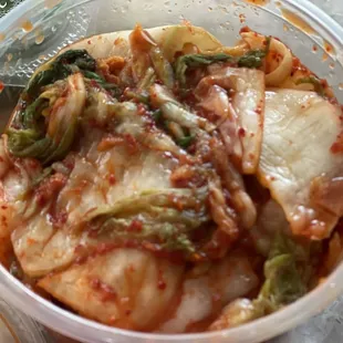 a plastic bowl of food