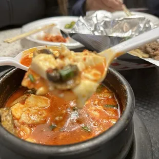 a bowl of soup being served