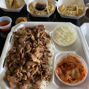 Pork bulgogi with kimchi, egg rolls and dumplings.
