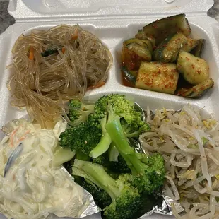 Sides (banchan). Comes with the meal. Clockwise: japchae, cucumber kimchi, mung bean salad, broccoli, creamy white seaweed salad.