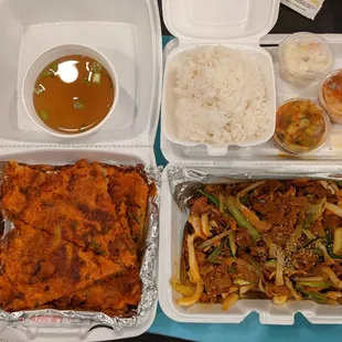 Top left: complementary miso soup Top right: rice and banchan Bottom Left: Kimchi Haemul Pajeon Bottom right: spicy pork Bulgogi