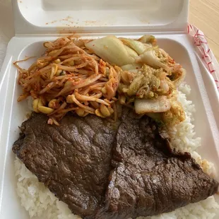 Bulgogi with kimchi, bean sprouts and rice.