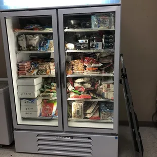 two refrigerators with food inside