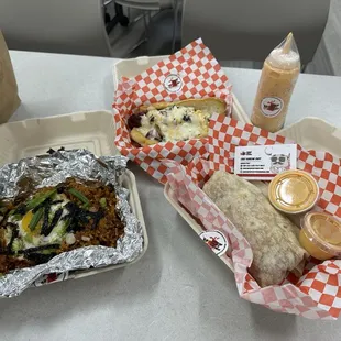Left to right: Korean Papi's fried rice, KP's hotdog, Orange Sawce bottle, KP burrito w/ kalbi