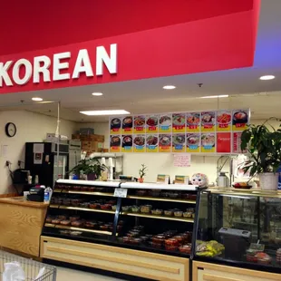 Store front of Korean Restaurant.  Inside the Super G Mart, back right corner of the market.