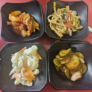 Side offerings....kimchi, fish cakes, picked cucumbers, and cauliflower w/ carrots.
