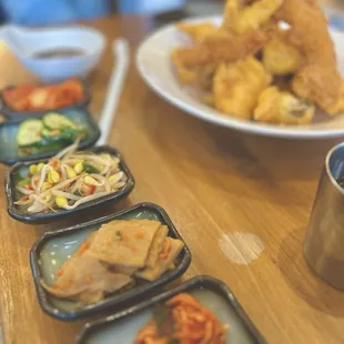 They served small plates with kimchi, cucumber, fish cake, and pickled sprouts with our meal